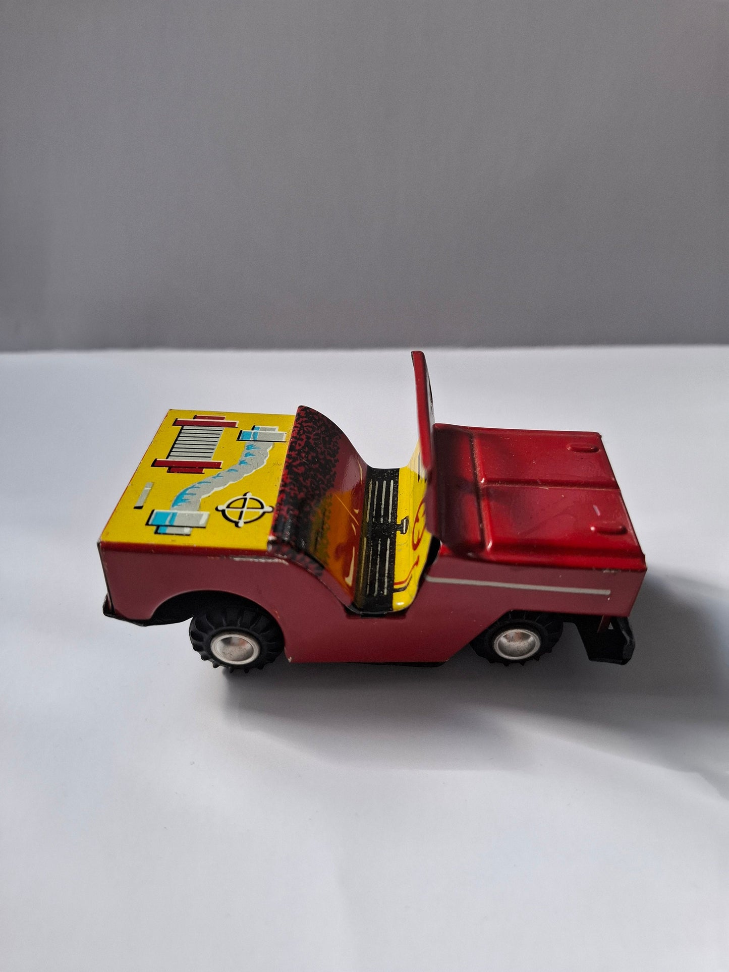 Charming Nostalgic Vintage  Tin Toy: Red Jeep - Classic Collectible Treasure