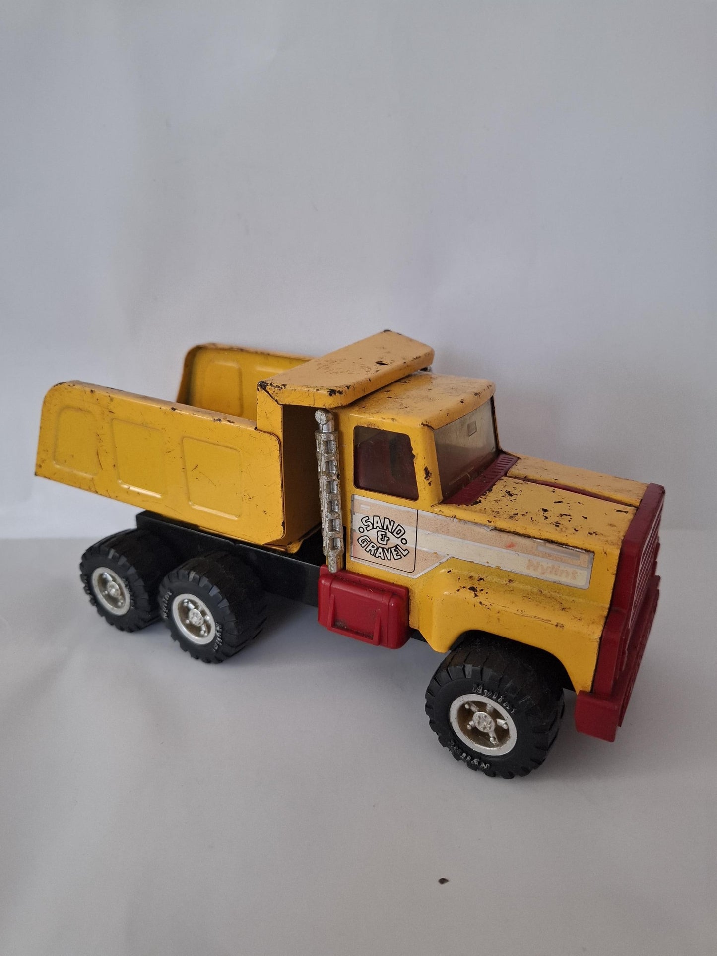 Nylint Pressed Steel and Plastic Sand & Gravel Small Dump Truck 8.25" Yellow Red