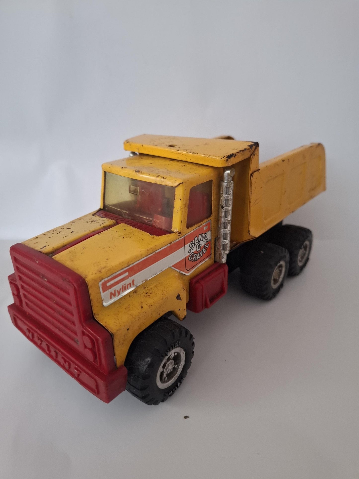 Nylint Pressed Steel and Plastic Sand & Gravel Small Dump Truck 8.25" Yellow Red