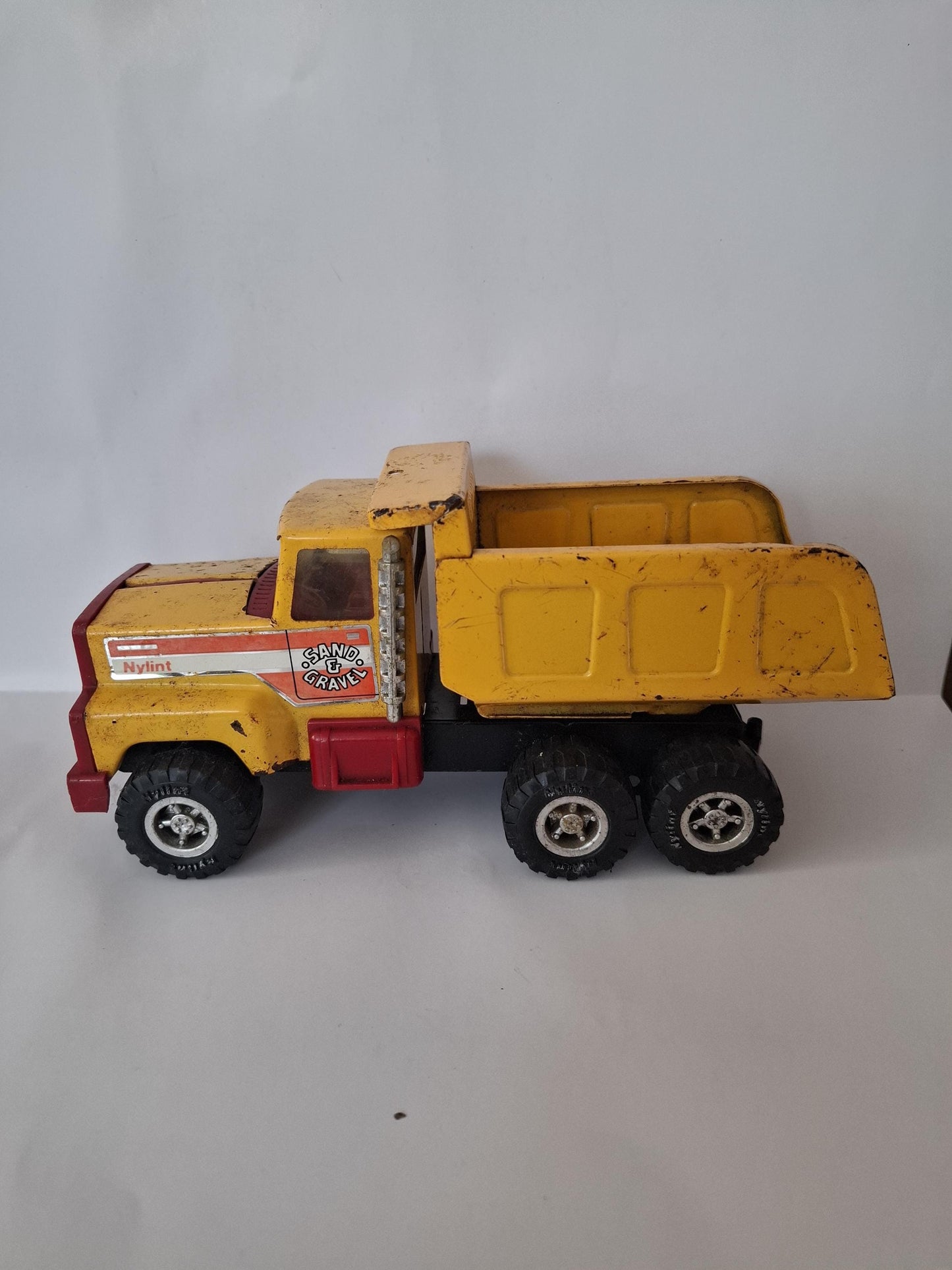 Nylint Pressed Steel and Plastic Sand & Gravel Small Dump Truck 8.25" Yellow Red