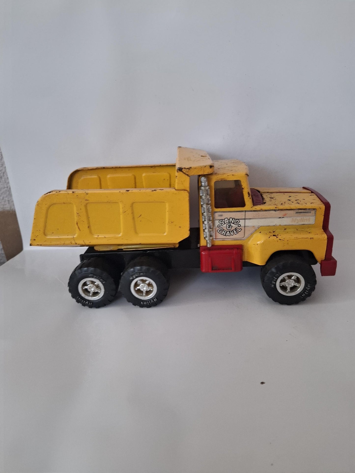 Nylint Pressed Steel and Plastic Sand & Gravel Small Dump Truck 8.25" Yellow Red