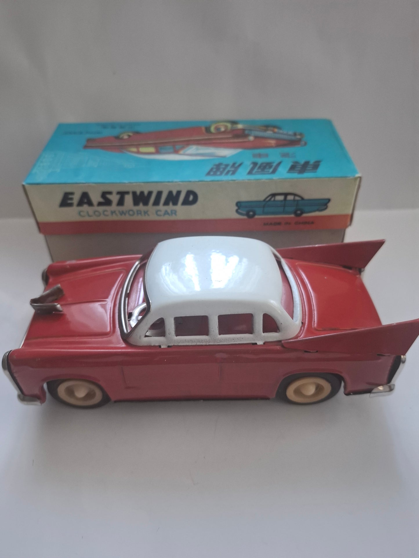 Tailfin Coupe Eastwind MS 836 with flywheel drive and siren, original packaging
