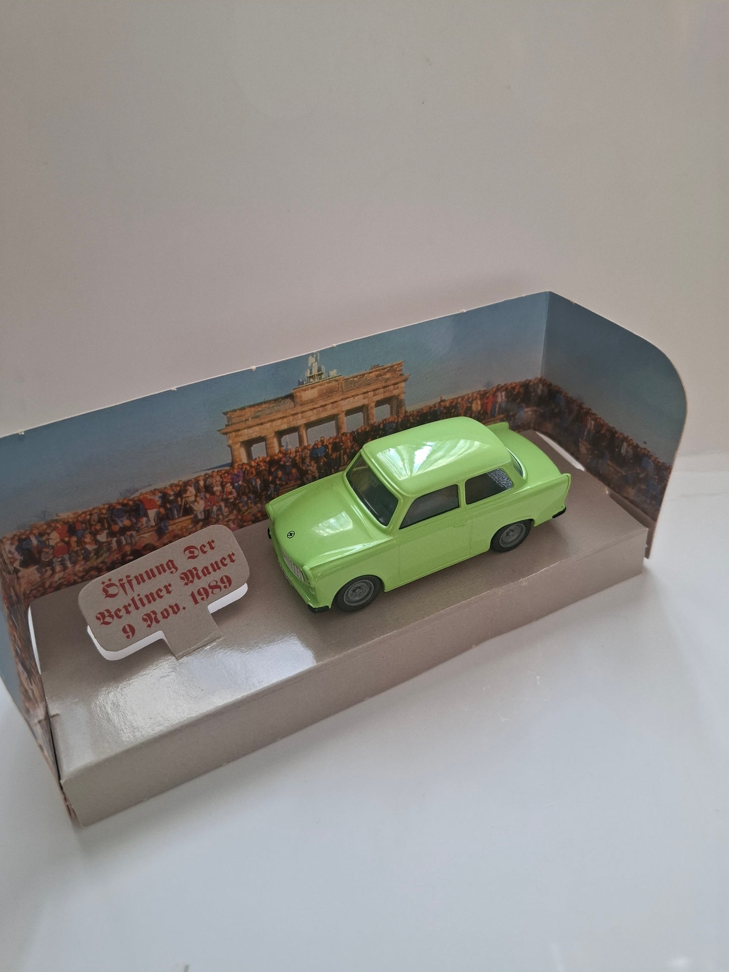 Trabant Trabbi model green in front of Brandenburg Gate "Opening of the Berlin Wall 1989"