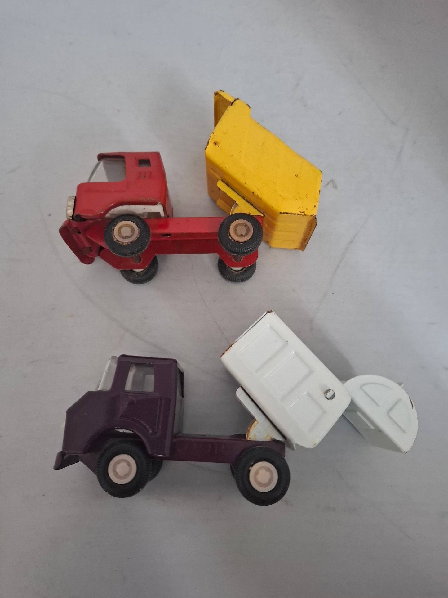 Vintage Lot of 2 pressed steel red metal ruck toys - made in Japan