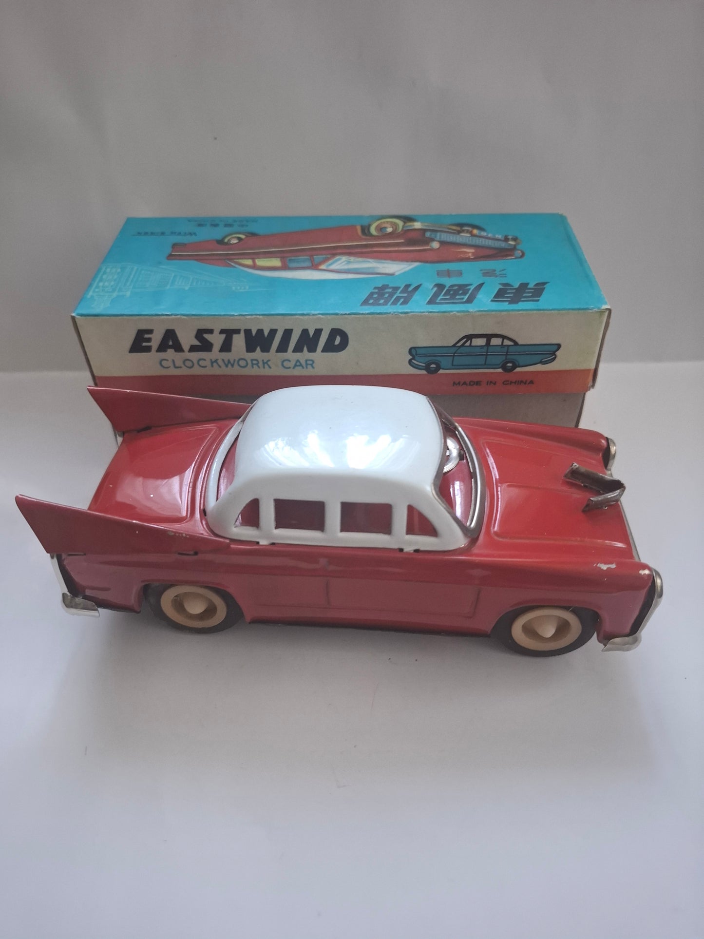 Tailfin Coupe Eastwind MS 836 with flywheel drive and siren, original packaging