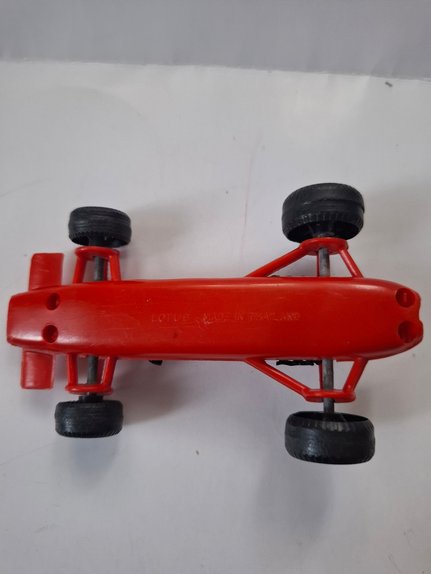Vintage Lotus Formula One Race Car No. 4 – Pennzoil Red Plastic Toy 4 1/2"
