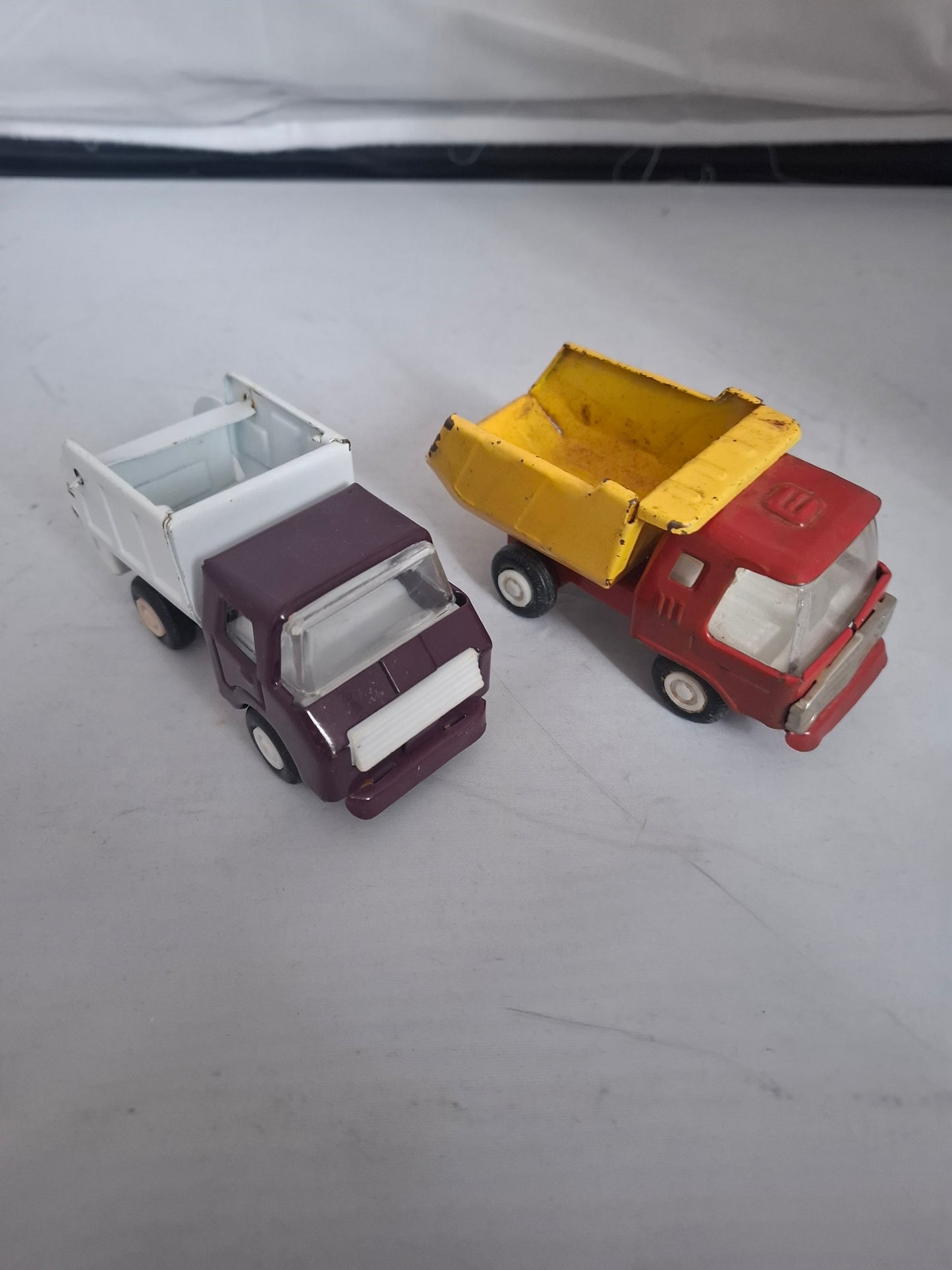 Vintage Lot of 2 pressed steel red metal ruck toys - made in Japan