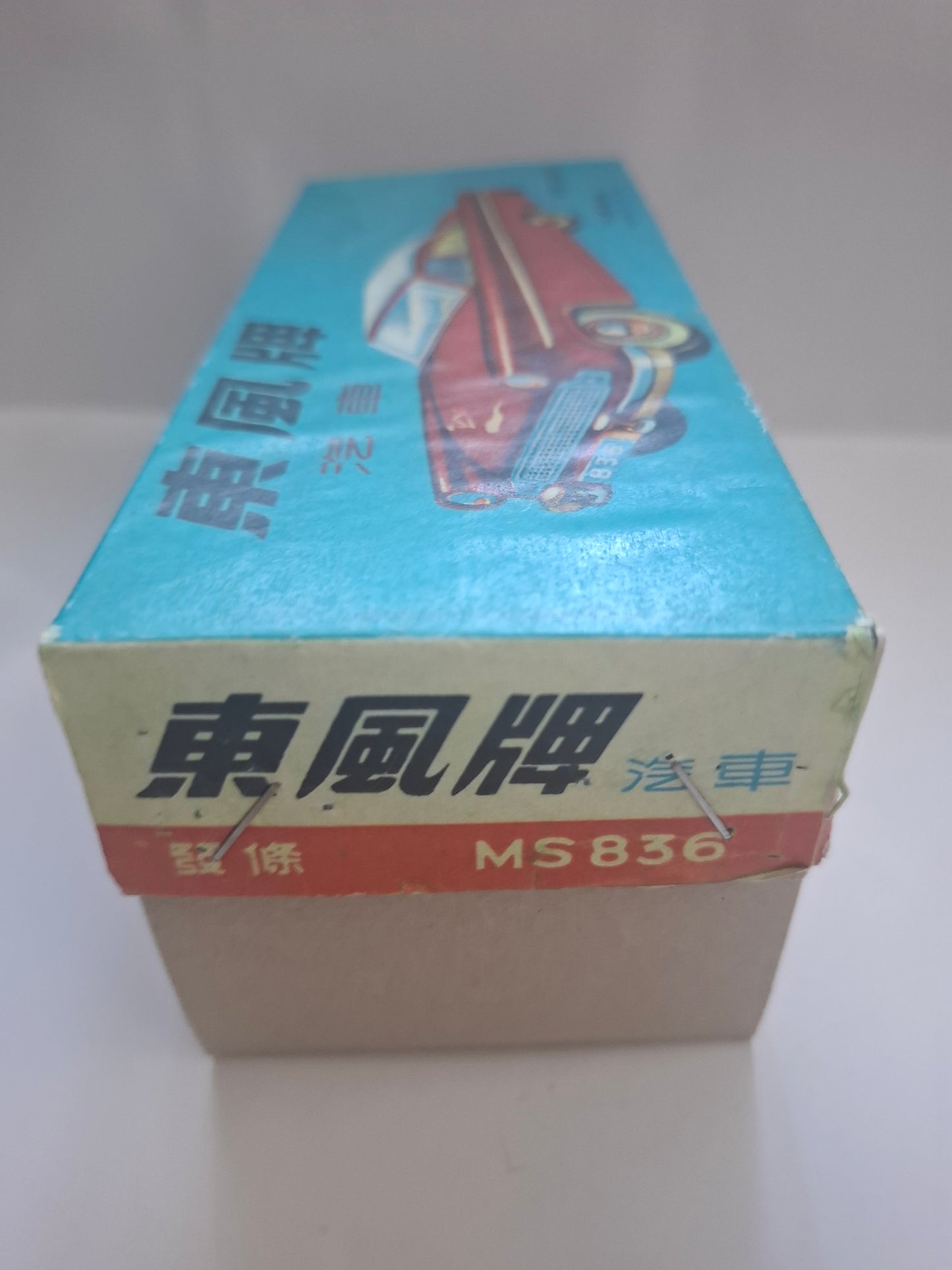 Tailfin Coupe Eastwind MS 836 with flywheel drive and siren, original packaging
