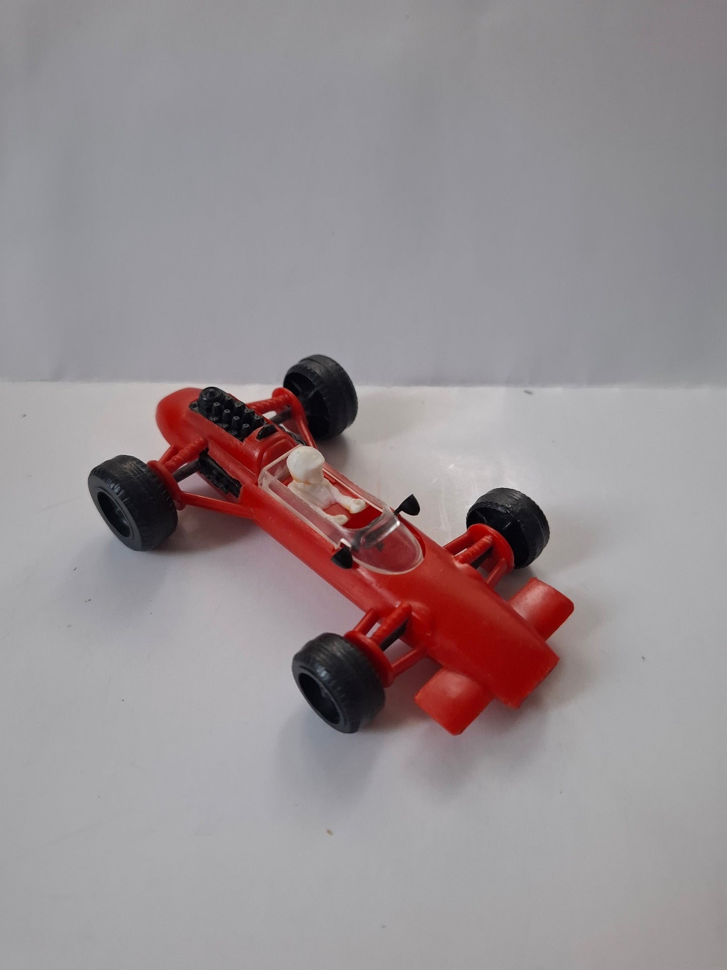 Vintage Lotus Formula One Race Car No. 4 – Pennzoil Red Plastic Toy 4 1/2"