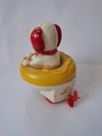 Very Cute little Vintage Blue Box Wind-Up Dog Toy in Yellow Life Raft - looks like snoopy :)