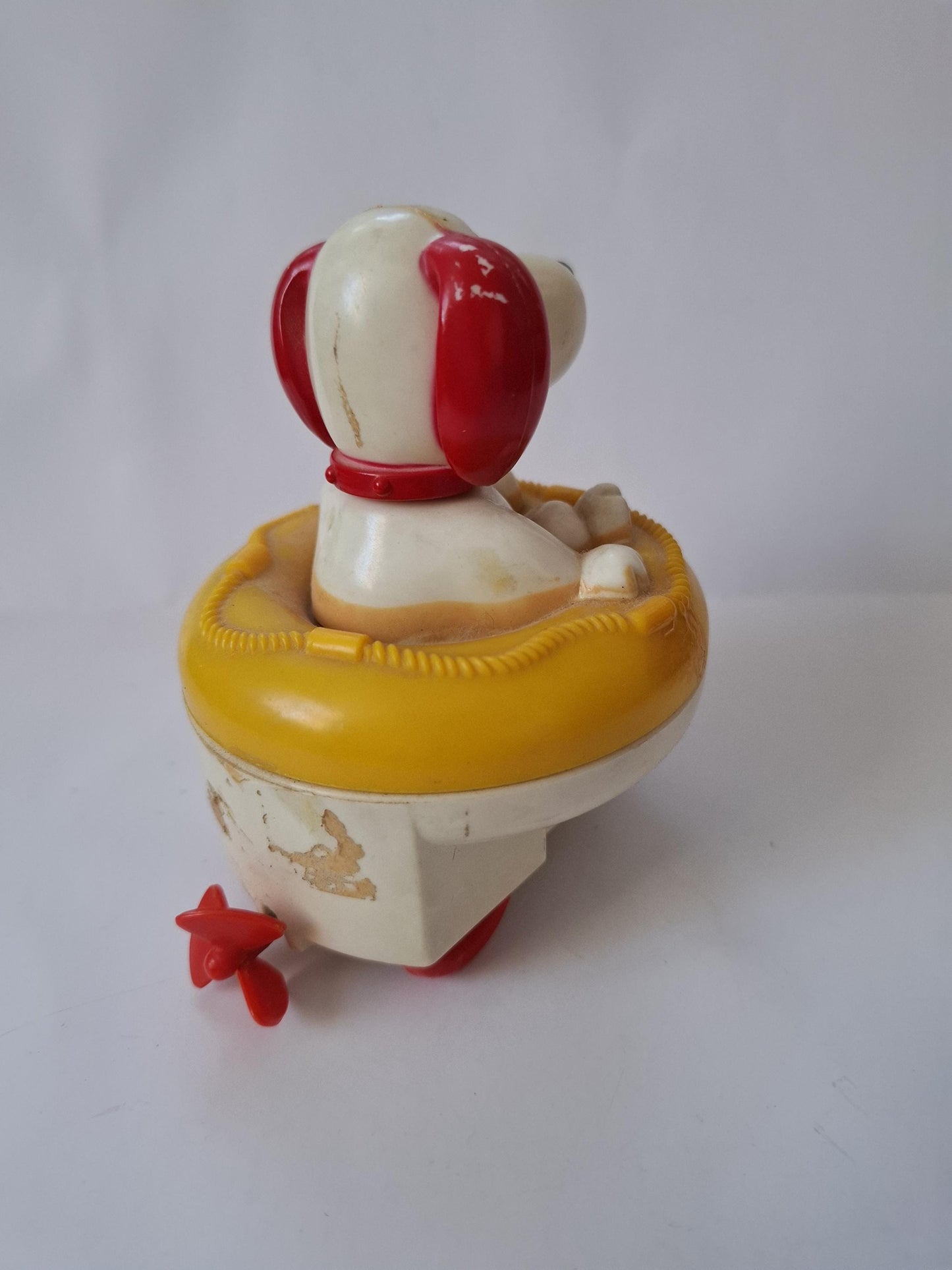 Very Cute little Vintage Blue Box Wind-Up Dog Toy in Yellow Life Raft - looks like snoopy :)