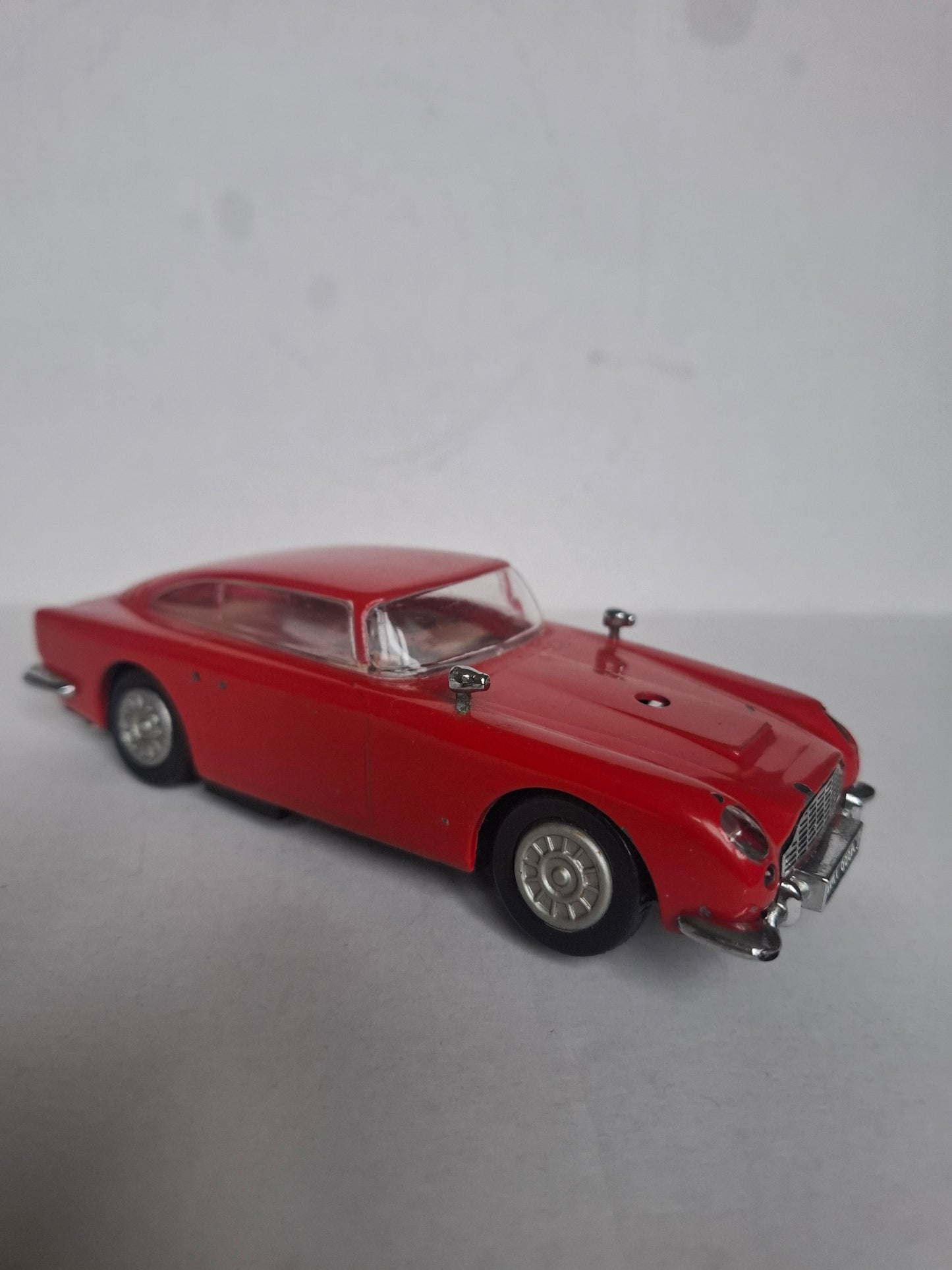 Vintage Diecast Aston Martin DB5 — Approx. 1:30 Scale — Solid Metal Model, Red — Parts Missing / Wear (1980s look)