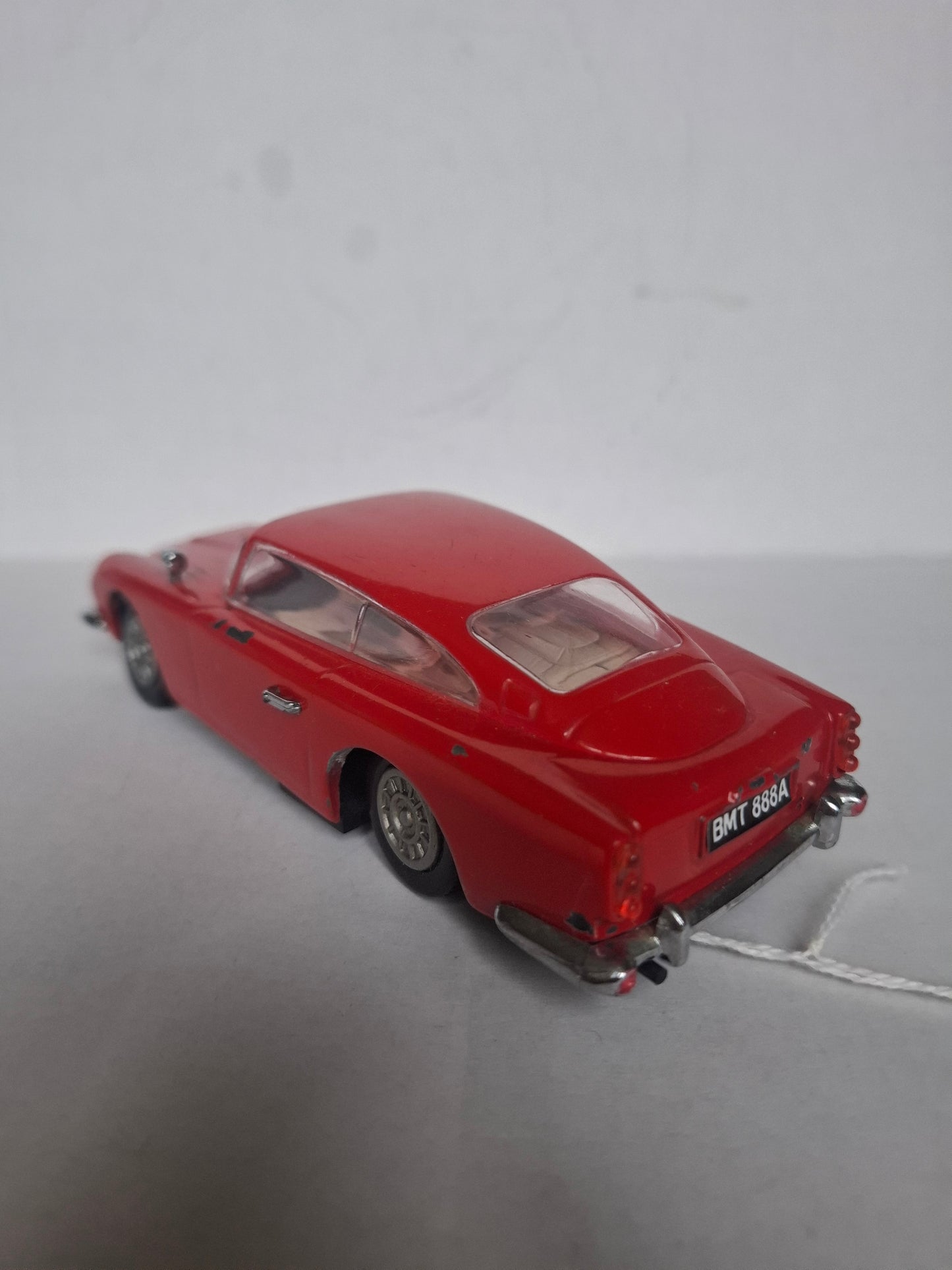 Vintage Diecast Aston Martin DB5 — Approx. 1:30 Scale — Solid Metal Model, Red — Parts Missing / Wear (1980s look)
